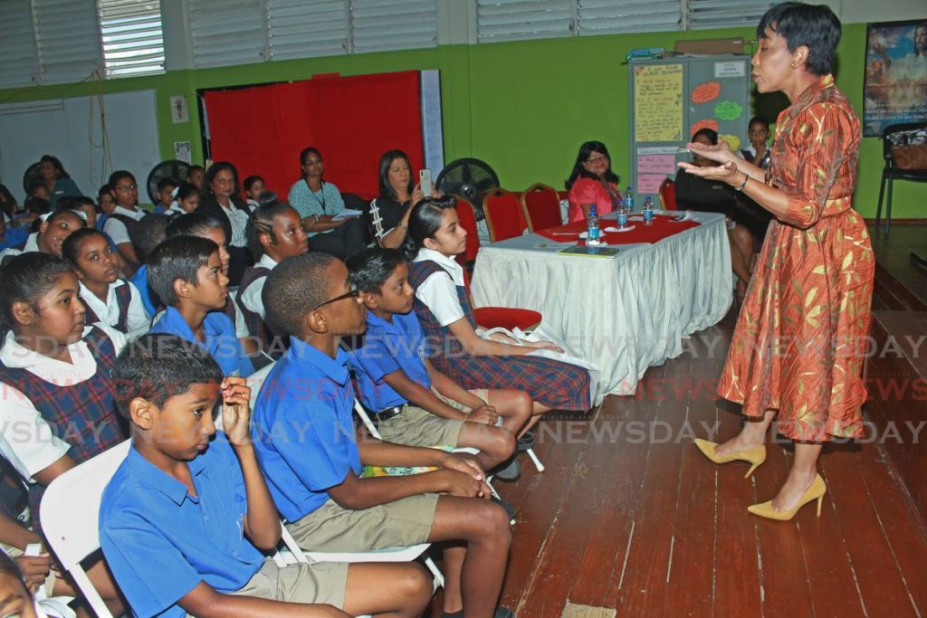 Sharon Rowley speaks to students of the Hermitage Presbyterian Primary School in San Fernando about the importance of reading.  PHOTO BY CHEQUANA WHEELER - CHEQUANA WHEELER