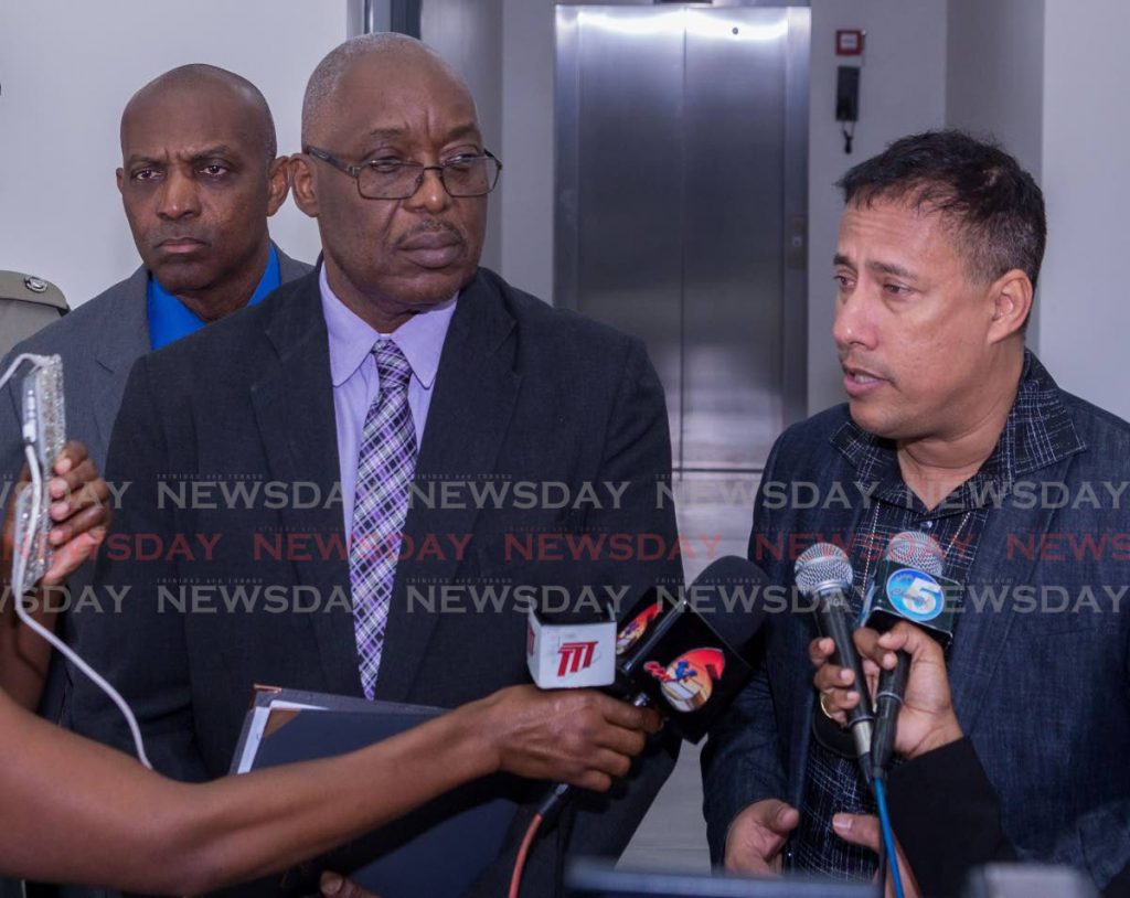 Commissioner of Police Gary Griffith, right, talks to the media after meeting with Chief Secretary Kelvin Charles, left, and the Business Chamber last week.  - DAVID REID 