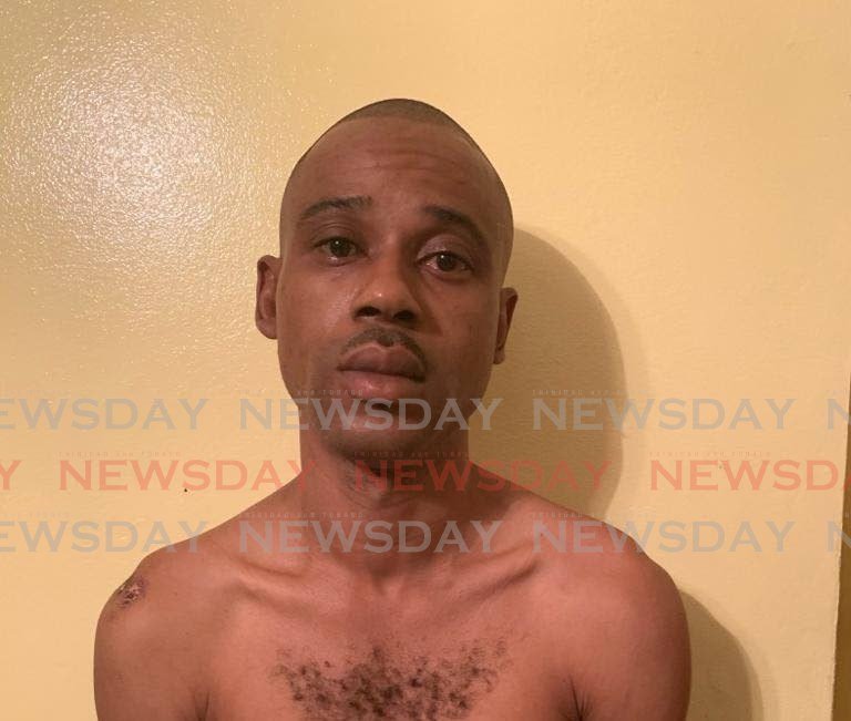 Kevin Clarke, 40, was arrested and charged with robbery with violence, kidnapping and the unauthorised use of ATM bank cards during a Tunapuna robbery last month. 
He was arrested at his Port of Spain home on Wednesday. 

PHOTO COURTESY TTPS - Shane Superville