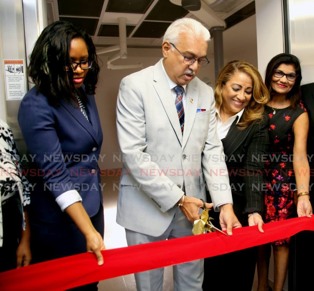 Health Minister Terrence Deyalsingh cuts the ribbon to open the new operating theater at the St James Medical Complex, which has been outfitted to accommodate the relocation of central block, with him on the right is NWRHA's chairman Lisa Agard and Dr Shaheeba Rarrow and on the left is the complex medical director Dr Kellie Alleyne-Mike PHOTO SUREASH CHOLAI - SUREASH CHOLAI