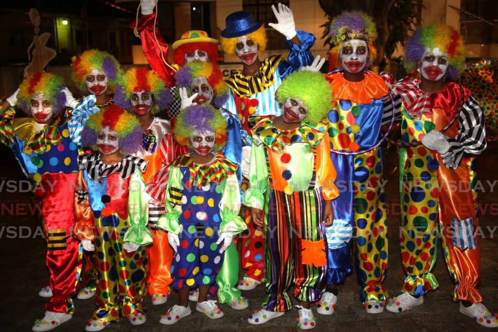 Members of the 34th Port of Spain Cub pack of Mucurapo Boys RC play clown mas at a parade of traditional mas characters hosted by the St James Social and Cultural Committee at the St James Amphitheatre, Western Main Road, St James on Wednesday night. - SUREASH CHOLAI