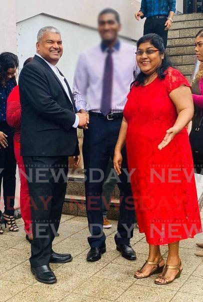 Bhagwantee Singh, right, is congratulated by attorney Anand Ramlogan, SC outside the San Fernando High court. Bhagwantee won a lawsuit against the SWRHA over the death of her son Navin Singh. - 