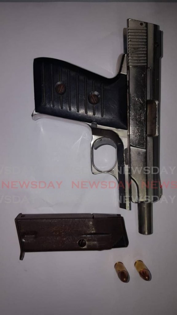 A Jennings 9mm pistol and two rounds of ammunition were seized from a Curepe man by officers of the St Joseph Police Station early on Monday morning.  

PHOTO COURTESY TTPS - Shane Superville