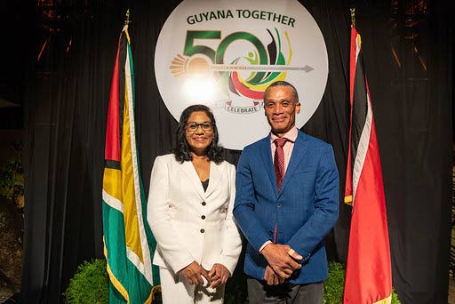 Guyana Ag High Commissioner Deborah Yaw with Foreign Minister Dennis Moses at a recent reception to mark Guyana's 50th anniversary as a co-operative republic.  In last Saturday's Newsday, a photo inadvertently identified a high commission employee as being Ms Yaw. The error is regretted.  - 