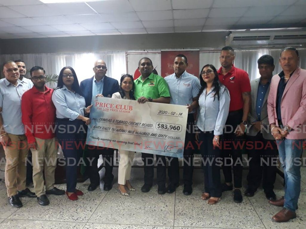 Price Club Supermarket owners, Mr. and Mrs. Shamshad Ali, centre, present TTCB president, Azim Bassarath, fourth from left, with a cheque for sponsorship of the Age Group North South Classic at NCC on Monday.  - JONATHAN RAMNANANSINGH