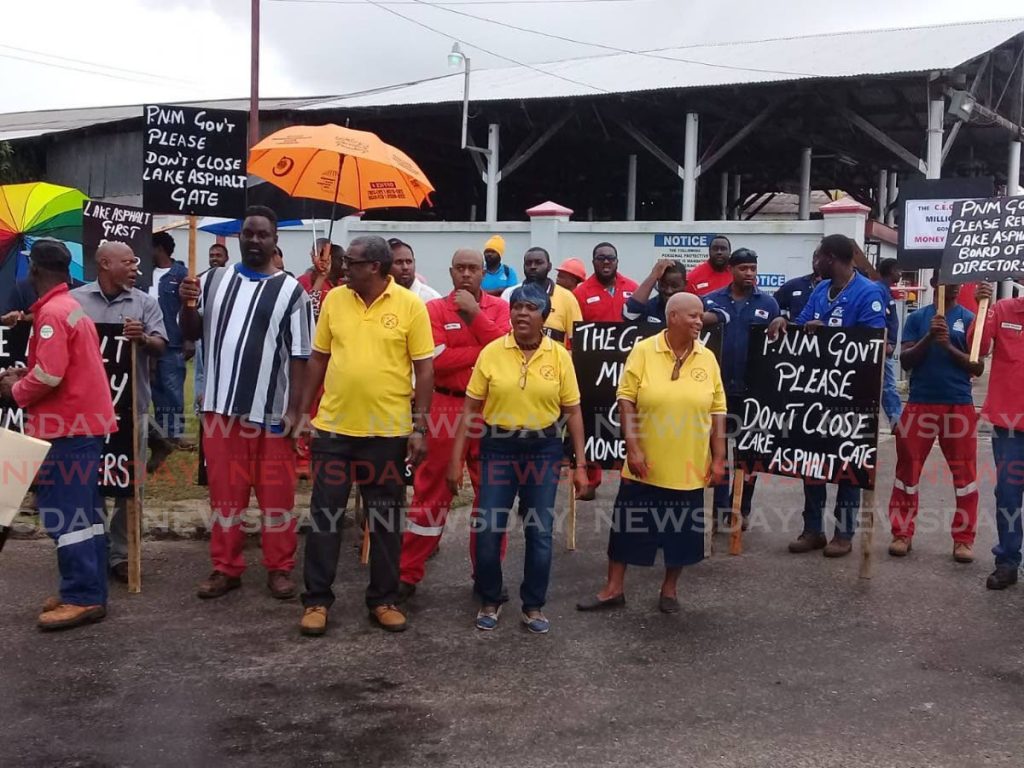 Lake Asphalt workers staged an early morning protest outside the company's compound, La Brea. - 