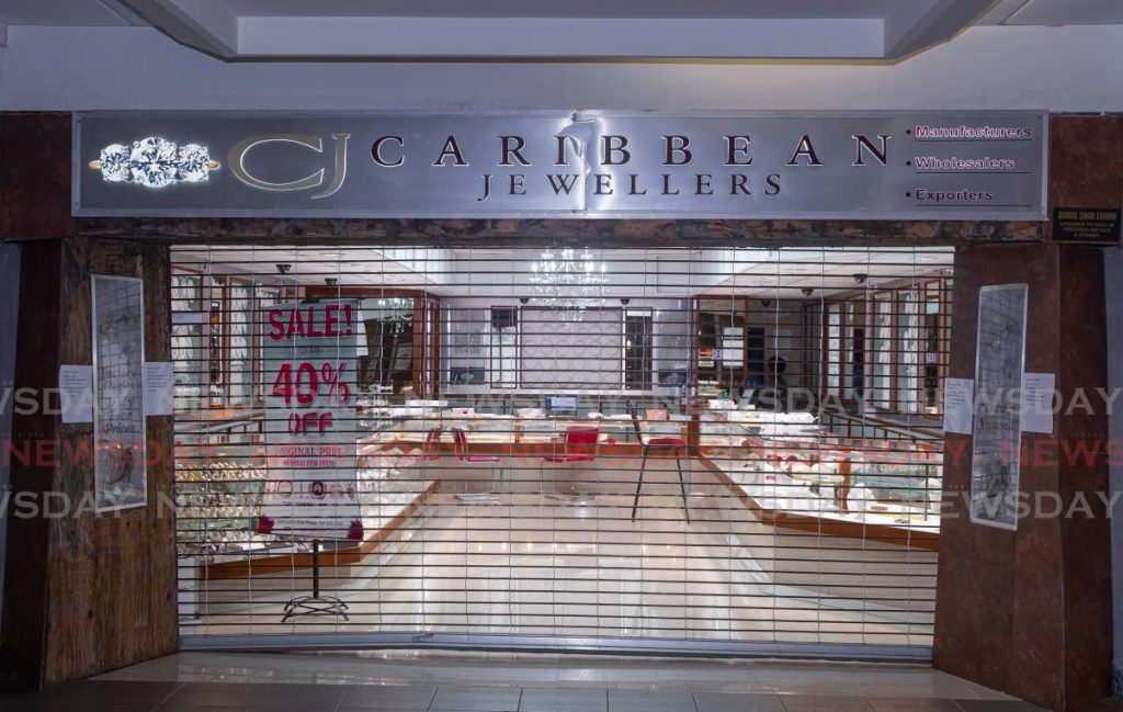 Caribbean Jewellers remained closed on Tuesday after a $2.45 million robbery on Monday at its Gulf City Mall, Lowlands branch.  - DAVID REID 