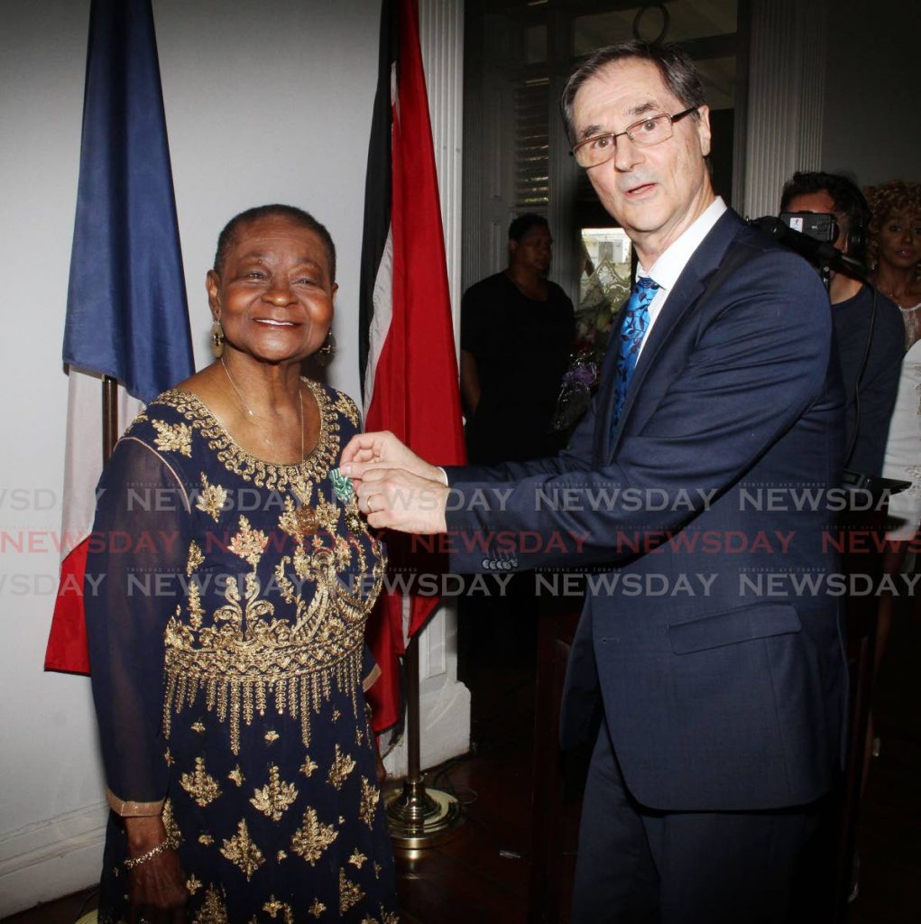 Linda McCartha Monica Sandy-Lewis aka Calypso Rose, is presented with the Officer of the Order of Arts and Letters, the highest French award for Arts and Culture, from French Ambassador Serge Lavroff, at the French Embassy, Mary Street, St, Clair on Thursday. - ANGELO MARCELLE