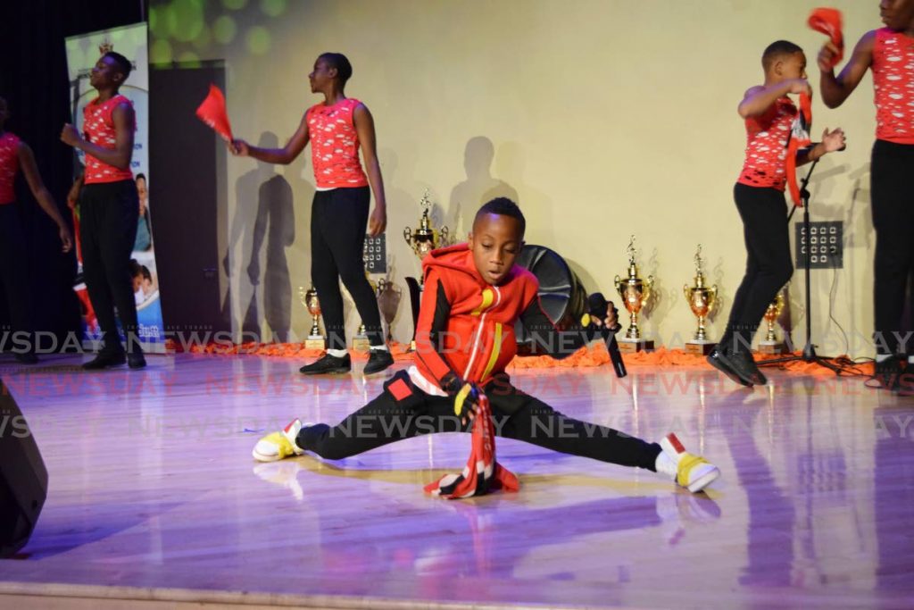 SOCA SPLIT: Sekel Mc Intosh gives a dynamic performance to retain his title in the Junior Soca Monarch (primary) Competition at the Government Campus Plaza auditorium in Port of Spain on Thursday.  PHOTOS BY VIDYA THURAB - 