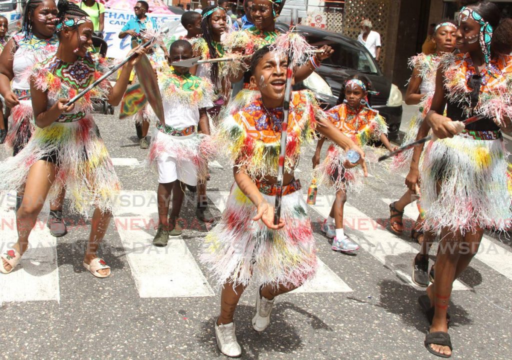 St Patrick Brigade masqueraders portray Ju-Ju warriors during the Traditional Mas parade, Knox Street, Port of Spain on Friday. - Ayanna Kinsale