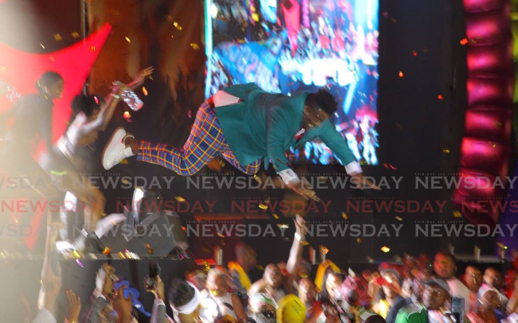 Andre “Ding Dong” Houlder takes a dive into the crowd during his performance of Outside at the 2020 Groovy Soca Monarch final, Queen’s Park Savannah, Port of Spain in February 2020. - ROGER JACOB