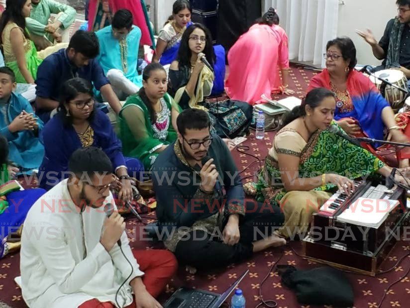 Hindu devotees as they gathered to observe Shiv Raatri at the Todd's Street, Hindu Temple, in San Fernando on Friday night. - 