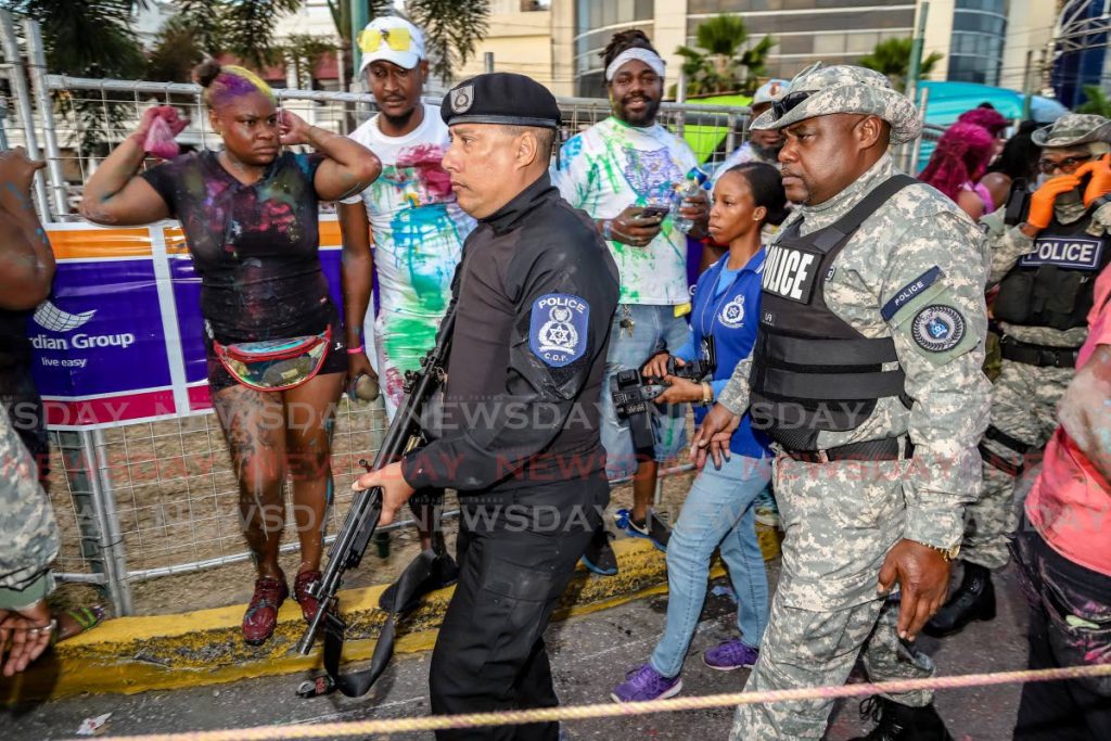 OUT AND ABOUT: Police Commissioner Gary Griffith on duty on Carnival Monday along the Western Main Road in St James during J’Ouvert celebrations.  - JEFF K MAYERS