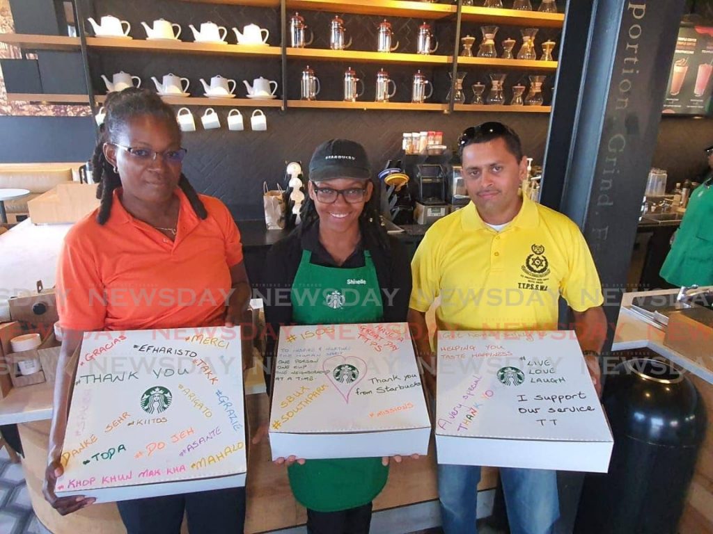 Police officers collect their pastries and coffee from a Starbucks location as part of an initiative the local franchise, under the Prestige Holdings Group, has engaged in with the police service's I Support Our Service initiative.  - 