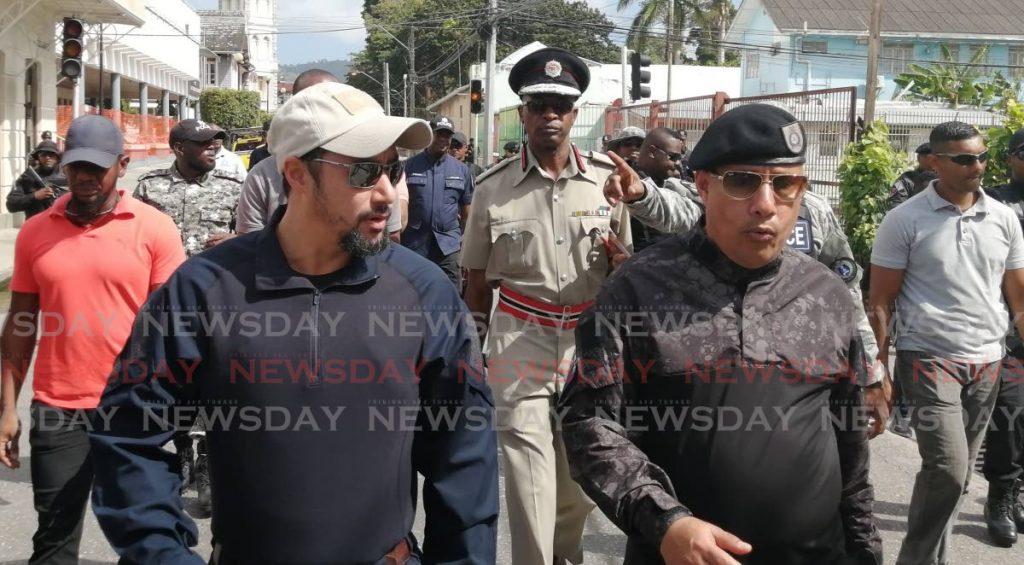Minister of National Security Stuart Young walks in POS with Commissioner of Police Gary Griffith while discussing security measures for the Carnival on Tuesday morning.  - Ryan Hamilton-Davis