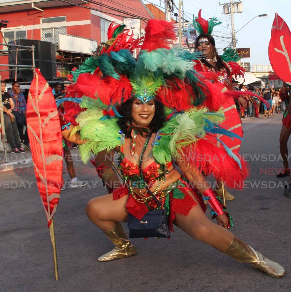 A masquerader from the band Madness Crew  enjoying herself in Chaguanas on Carnival Tuesday  - Vashti Singh