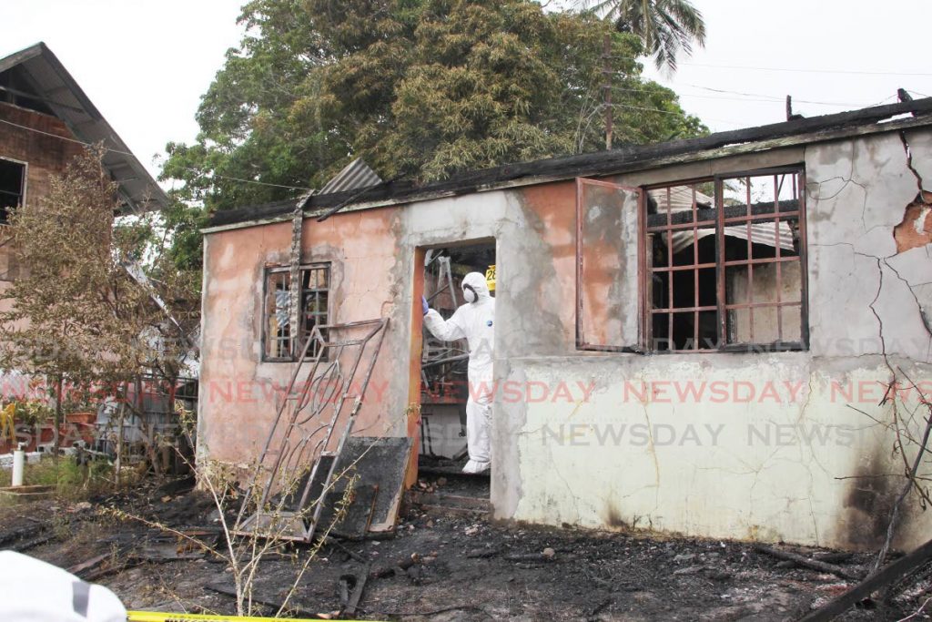 Crime scene investigators examine the site at which Ceslyn 