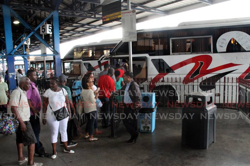 In this January 2, 2019 file photo commuters wate to board at bus at City Gate, Port of Spain.  - SUREASH CHOLAI