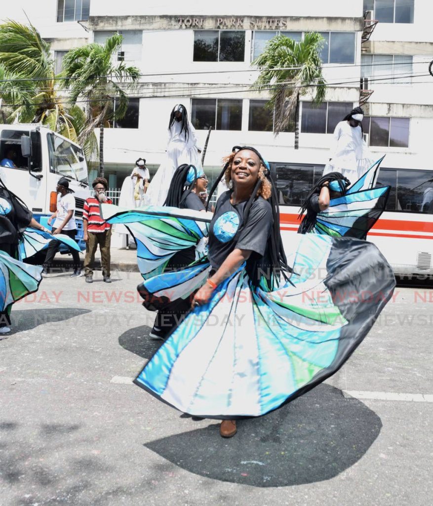 Actress Penelope Spencer dances in Peter Minshal's Mas Pieta as she crossed the judging point at Victoria Square on Carnival Tuesday afternoon. - Vidya Thurab
