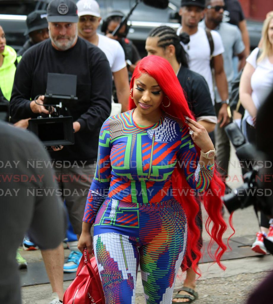 Trini-born hip hop artiste Nicki Minaj and members of her entourage arrive at the St Jude’s Home for Girls on February 27. At the end of her visit, she willingly posed for photos with many children from the home and surrounding schools. - Sureash Cholai