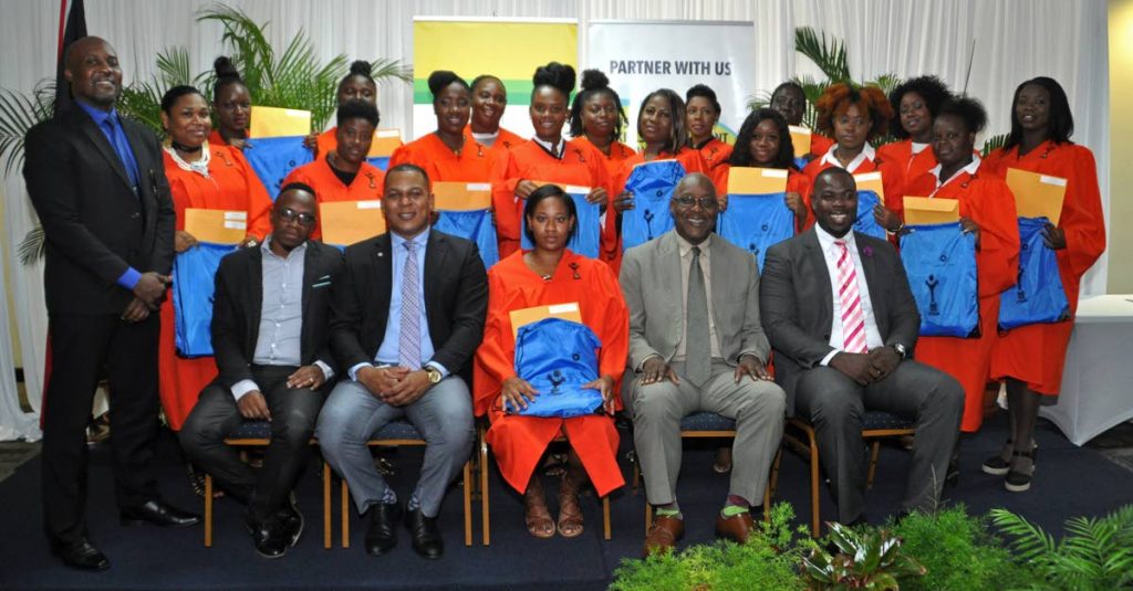  Tobagonian BPTT-YTEPP cosmetology graduates share the spotlight Nigel Parris, standing, left, CEO, YTEPP; Joel Primus sitting, second from left, CSSR advisor, BPTT; and Kelvin Charles, sitting, second from right, Chief Secretary, THA. - 