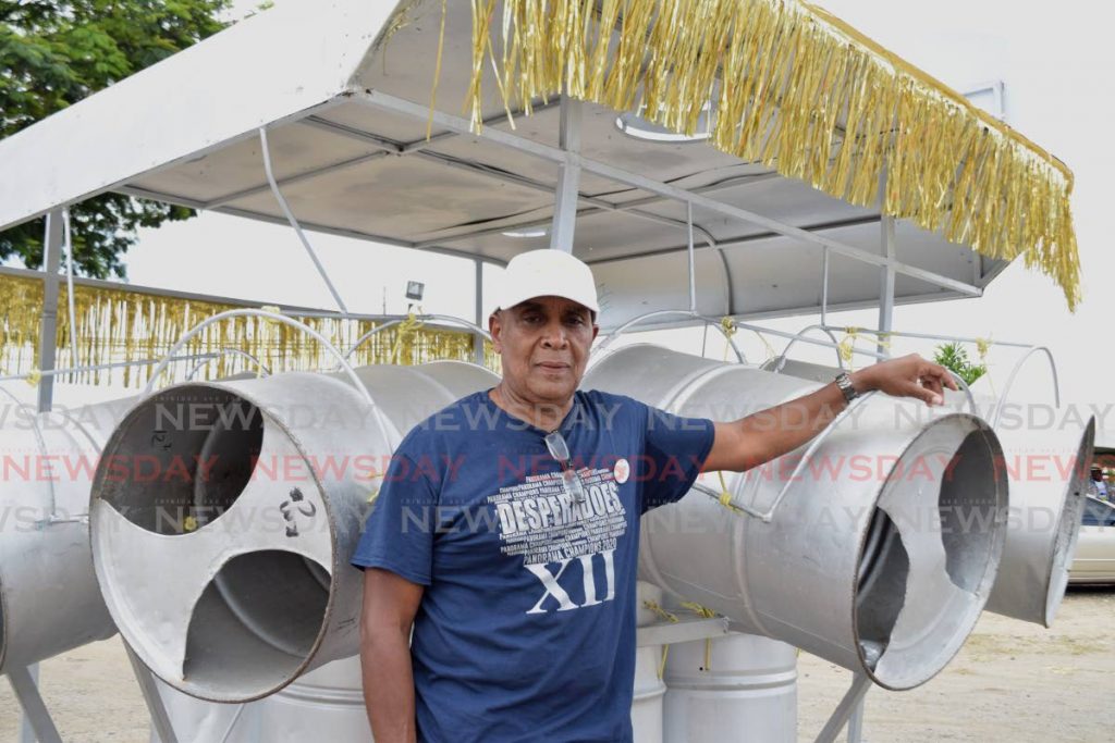 Desperadoes Steel Orchestra manager Dr Finbar Fletcher awaits the arrival of band members and supporters to start the band's victory motorcade at the Desperadoes panyard on Tragarete Road, Port of Spain on Sunday. - Vidya Thurab