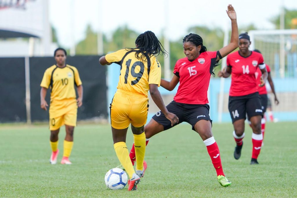 In this October 2,2019 file photo, TT’s Afiyah Cornwall (15) vies for the ball against an Antigua and Barbuda player, during a Concacaf Womens Olympic Zone Qualifying match, at the Ato Boldon Stadium, Couva. -  Daniel Prentice/CA-images