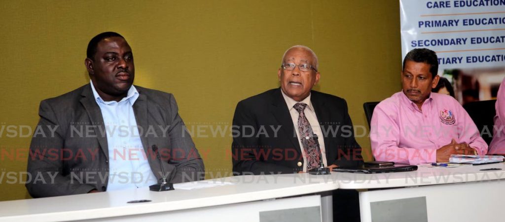 Education Minister Anthony Garcia (middle), flanked by Joseph Brewster (left) president of the TT Secondary Schools Track and Field Association, and Association’s PRO Arnold Rampersad, at the launch of the 2020 Championships, at the Ministry’s head office on St Vincent Street in Port of Spain on Tuesday. 
 - SUREASH CHOLAI