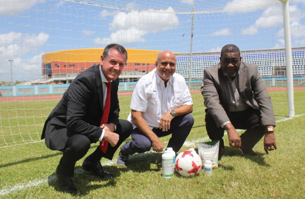 TTFA President William Wallace at right with Caribbean Chemicals chairman Joe Pires and Mens Senior Team head coach Terry Fenwick on the pitch at the Ato Boldon Stadium. Photo:TTFA - TTFA Media