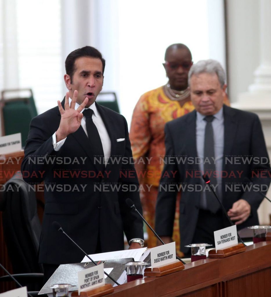 Attorney General Faris Al-Rawi, left, with Finance Minister Colm Imbert and Planning and Development Minister Camille Robinson-Regis in Parliament earlier in March. - Angelo Marcelle