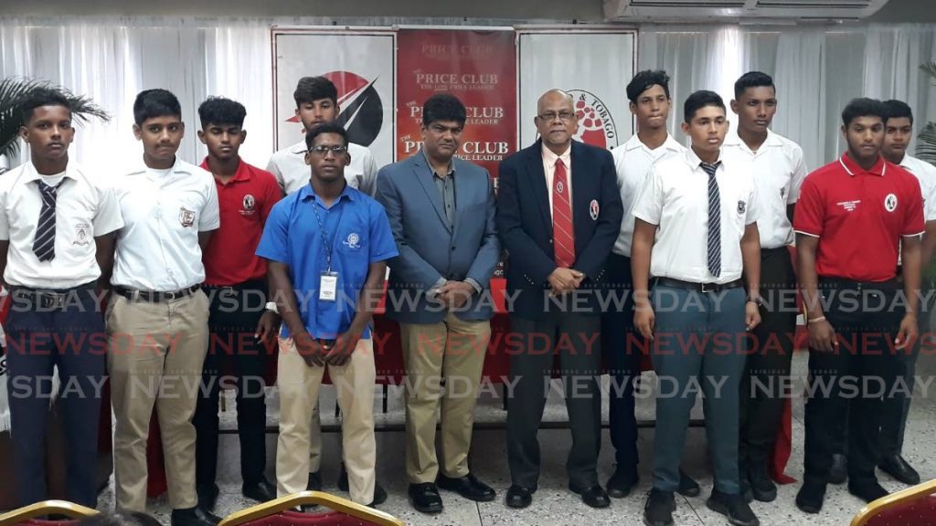 The Price Club Supermarket director, Shamshad Ali, centre left, and TTCB president Azim Bassarath, centre right, with some of the participating cricketers for this year’s Zonal U-17 Tournament. - JONATHAN RAMNANANSINGH