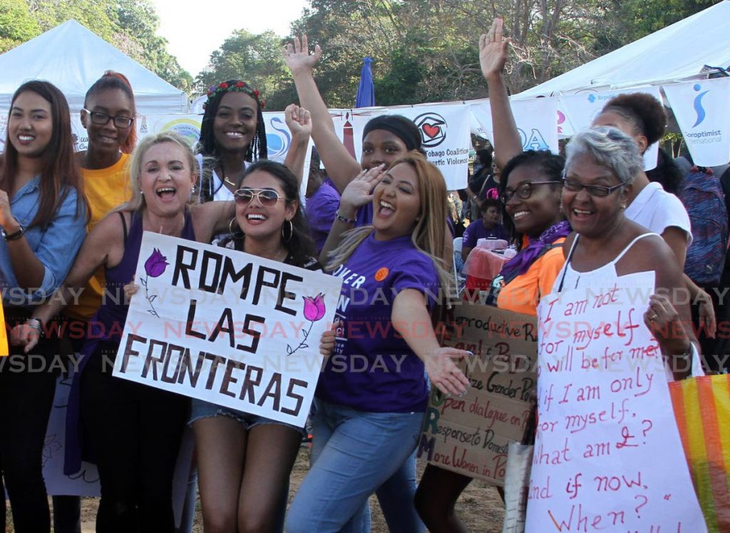 Venezuelans join local activists for the International Women’s Day rally at Queen’s Park Savannah, Port of Spain on Saturday. - 