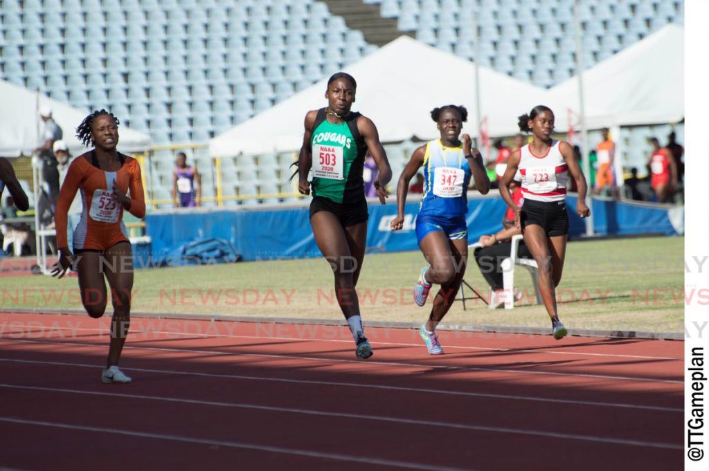 Shaniqua Bascombe (C) races to the finish line in the  Girls Under-20 100m, at the TT Carifta Trials, at the Hasely Crawford Stadium, Port of Spain, on Saturday. - Dennis Allen