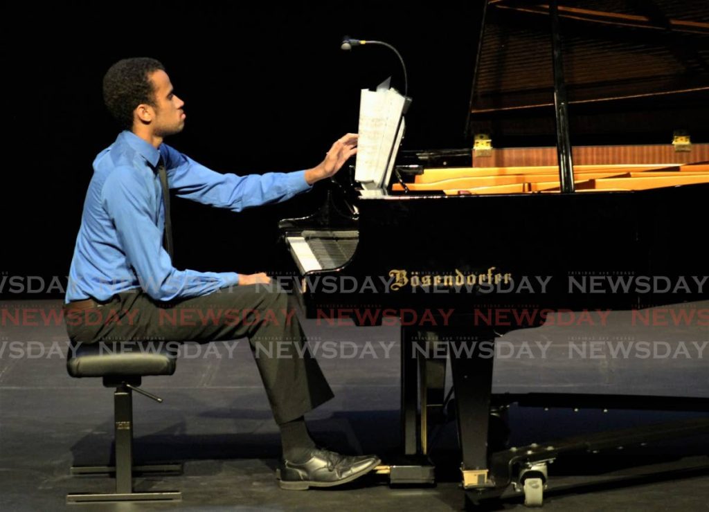 Dominic Creese winner of the Piano Solo at the 33rd Biennial Music Festival at Queen's Hall, St Ann's on Saturday. - Gary Cardinez