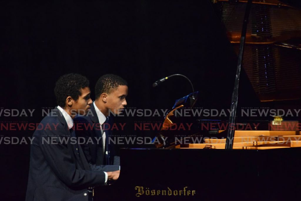 Nicholas Gooding and Matthew Newallo perform Dolly No 1 Berceuse by Gabriel Faure in the piano duet, 17 and under category at Music Festival at Queen's Hall, St Ann's, Port of Spain. - Vidya Thurab
