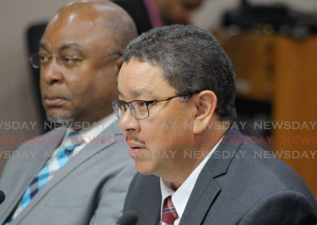 Acting CEO of WASA, Alan Poon-King (right),  and Sherland Sheppard, director of operations
at Monday's sitting of the Joint Select Committee for Land and Phsyical Infrastructure.   - ROGER JACOB