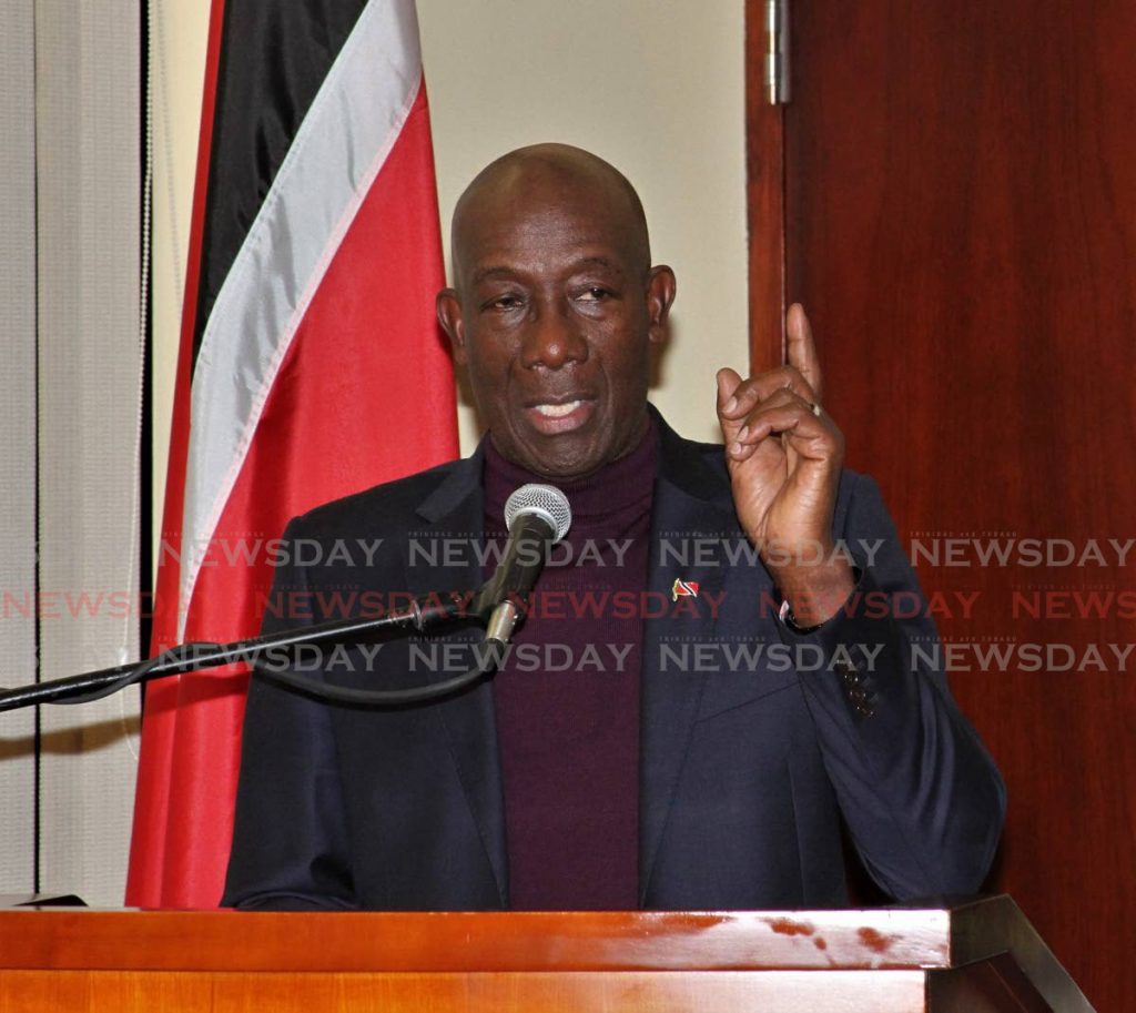 Prime Minister Dr Keith Rowley speaks to media in the VIP room at the Piarco International Airport after returning to TT from Ghana on Tuesday. - ANGELO MARCELLE