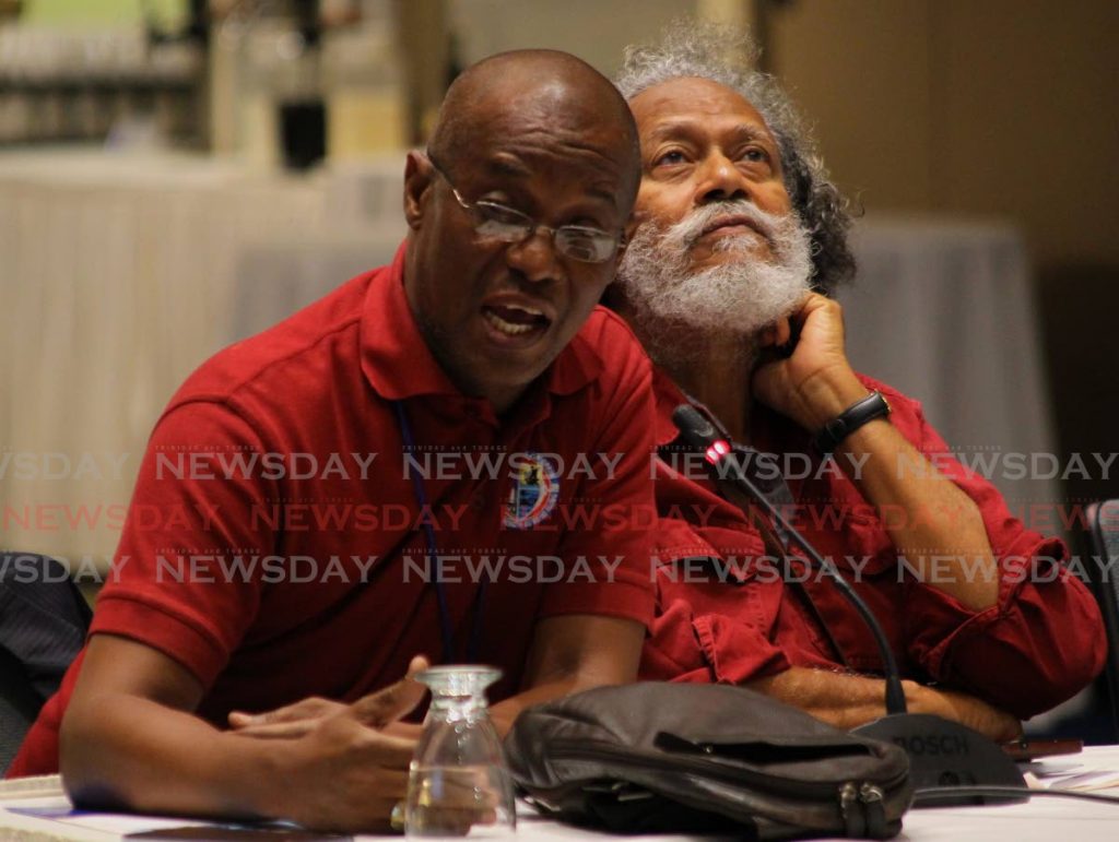 Radio personality and alderman Wendell Stephen speaks at a symposium on the coronavirus at the Hilton Trinidad, St Ann's, Port of Spain, on Wednesday as journalist Tony Fraser looks on. - ROGER JACOB