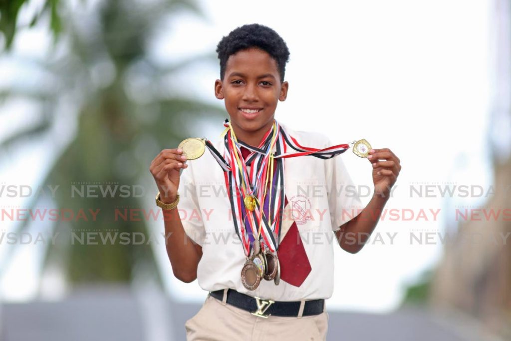 Coffee Boys Anglican Primary School student Brandon Luces excels in several sports including cycling, football and basketball. PHOTOS BY MARVIN HAMILTON - 