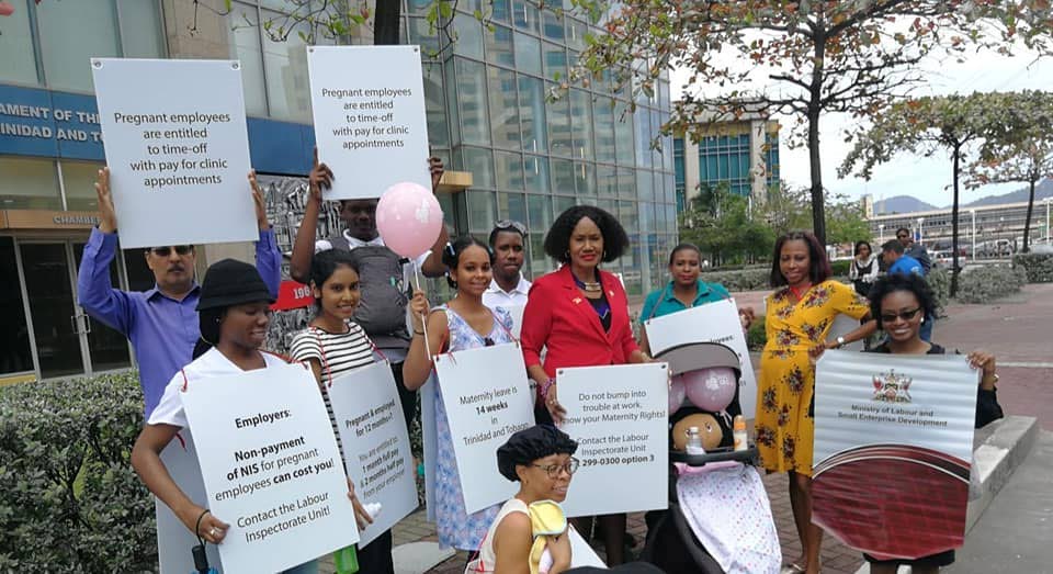 Minister of Labour and Small Enterprise Development, Jennifer Baptiste-Primus, centre, is joined by staff for the ministry's Maternity Matters at Work Road Show in Port of Spain in early March. - 