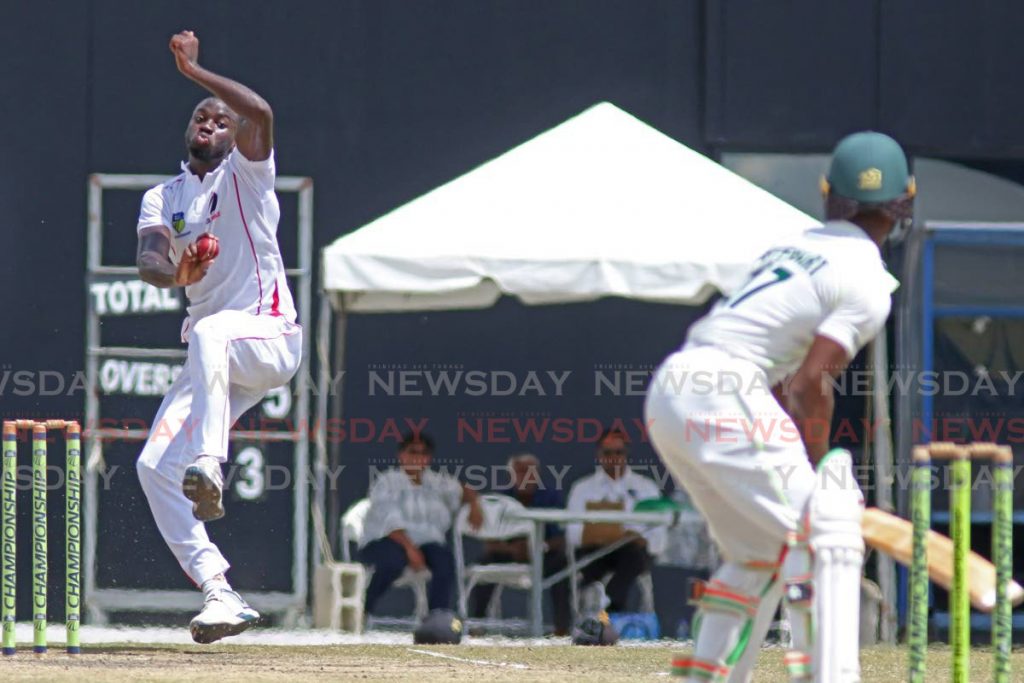 TT Red Force fast bowler Anderson Phillip (left) prepares to unleash a delivery to Windward Islands Volcanoes’ Emmanuel Stewart on the third and final day of the teams’ West Indies Four Day Championship match at the Brian Lara Cricket Academy. PHOTO BY MARVIN HAMILTON - Marvin Hamilton