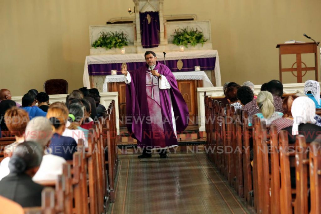 Archbishop Jason Gordon delivers a sermon during midday mass at St Mary's College chapel on Frederick Street, Port of Spain on March 4. As of Saturday, the Catholic Church suspended services due to the coronavirus. - Sureash Cholai