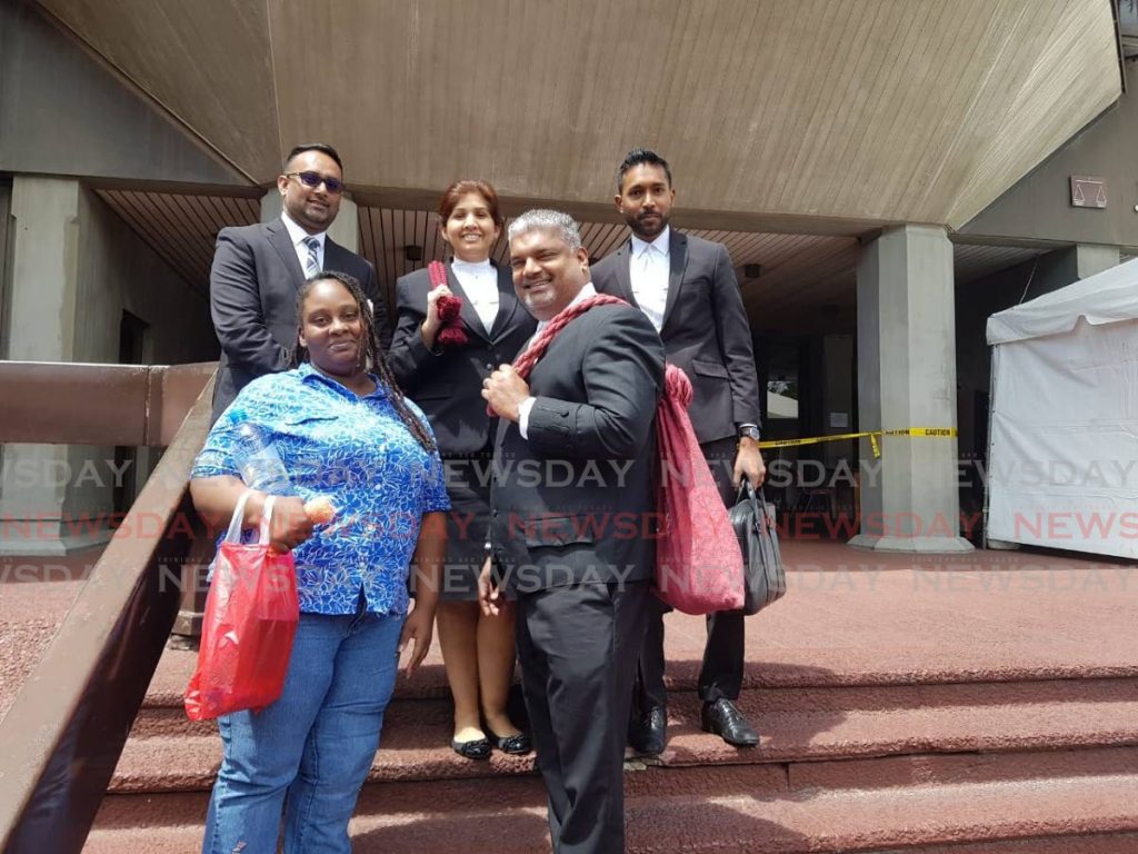FREED: Alicia George, left bottom row, and her attorneys Anand Ramlogan,SC, Alvin Pariagsingh, left upper row, Jayanti Lutchmedial and Ganesh Saroop outside the Hall of Justice, Port of Spain, after Justice Kevin Ramcharan ordered her immediate release from prison. - Jada Loutoo