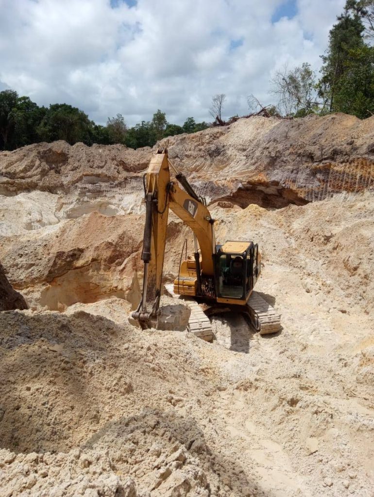 One of the excavators seized by police and soldiers at Pine Road, Matura during a crackdown on an illegal quarry. - 