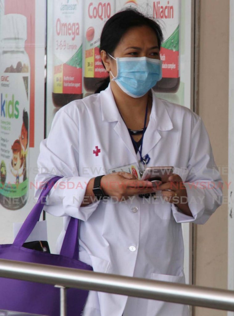 A nurse is seen wearing a mask at Xtra Foods Supermarket.  Photo: Vashti Singh