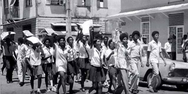 Students shout 'power' while marching  during  the  1970 Black  Power  uprising. - 