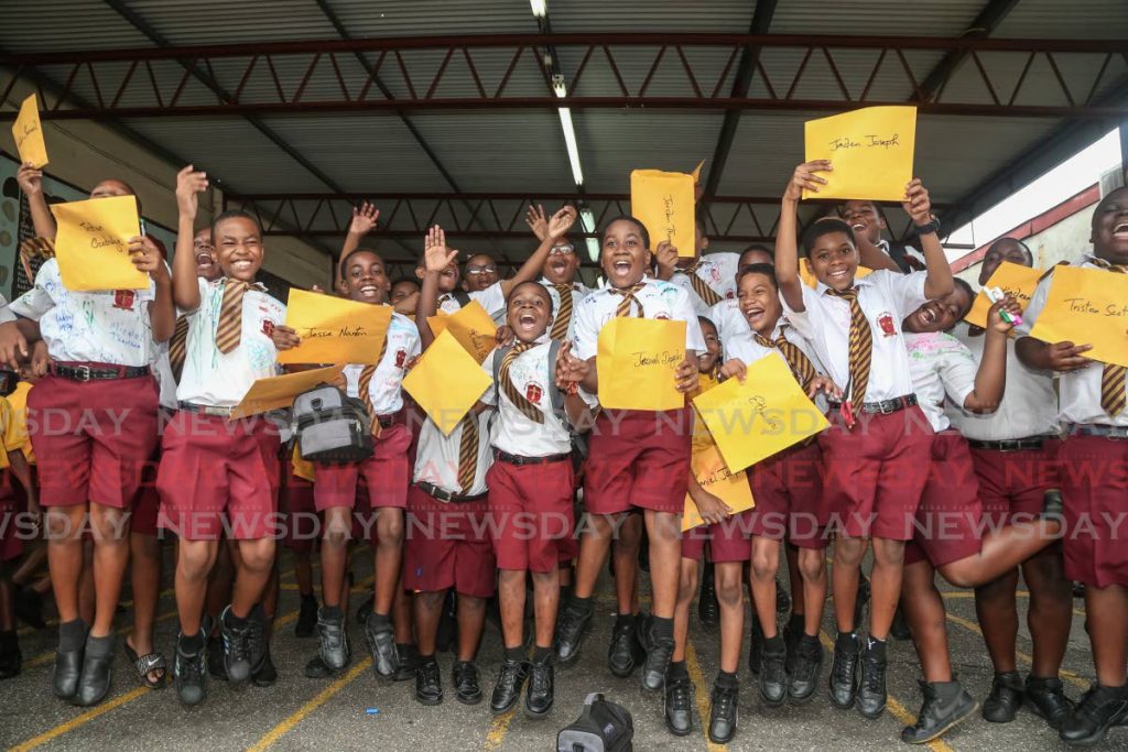 In this 2019 file photo, students of Richmond Street Boys primary school react after receiving their SEA exam results. - Jeff K Mayers