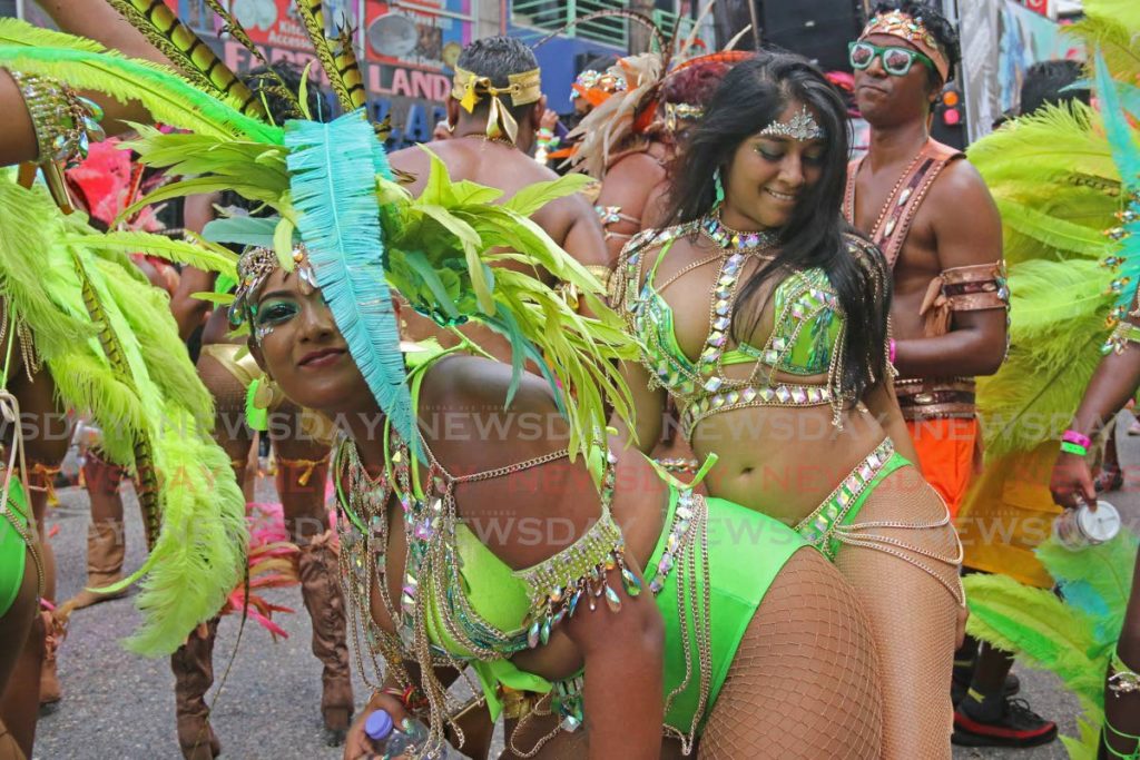 JAM SESSION: This photo, taken on Carnival Tuesday, shows masqueraders having a good time on High Street in San Fernando, at a time when there were no confirmed covid19 cases in the country.- Marvin Hamilton