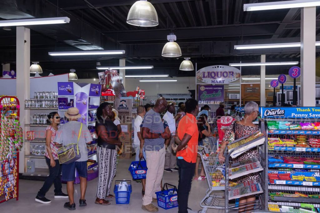 The scene inside Penny Savers in Bon Accord, Tobago on March 19 before social distancing measures were implemented to prevent the spread of the covid19 virus.  PHOTO BY DAVID REID - 