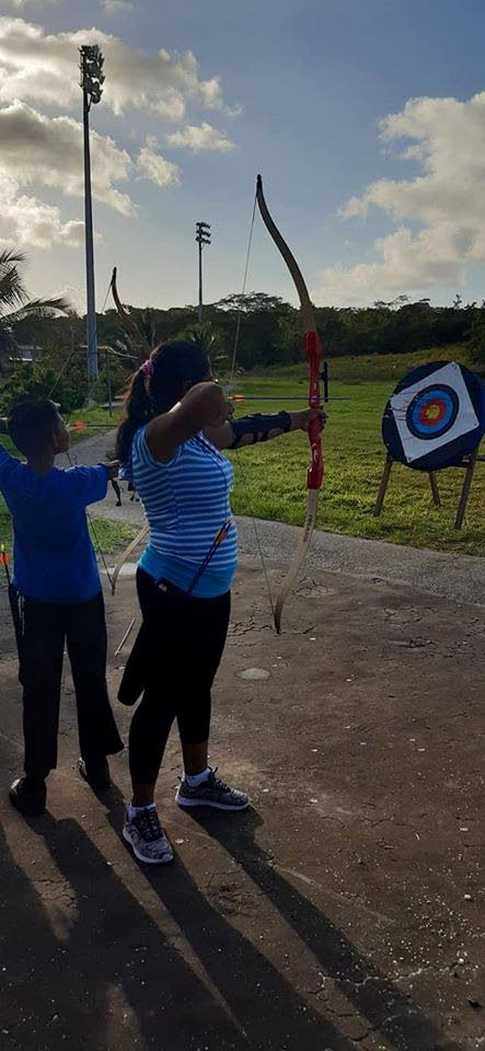 A young archer takes aim at Mendez Sporting Club’s recent introduction to archery programme. - Mendez Sporting Club